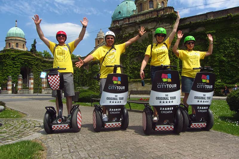 Zagreb tour - Zagreb Leisure Tour - four people driving segway at Mirogoj
